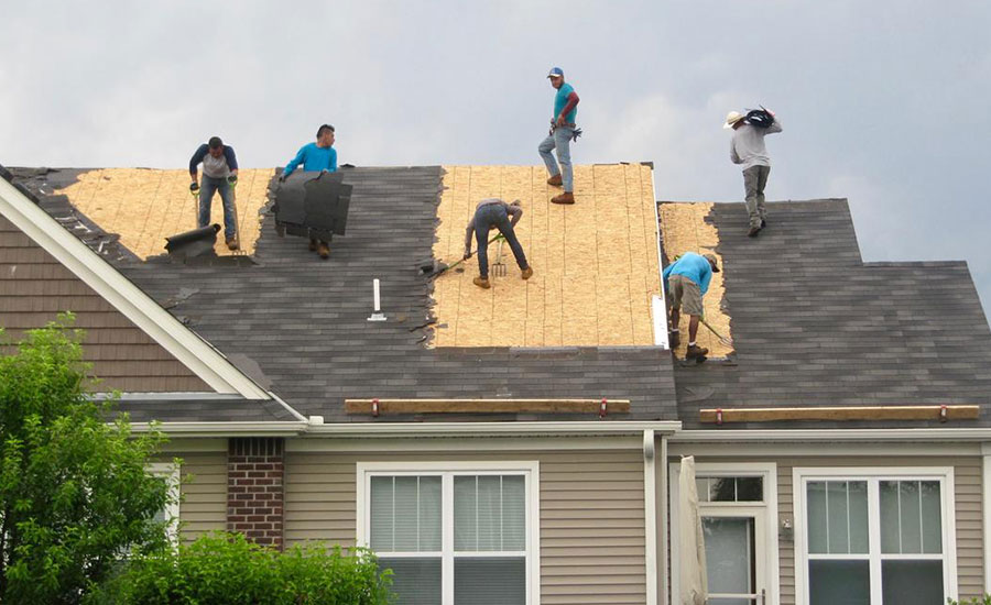 people working on a roof