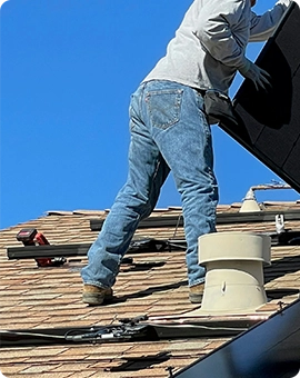 man working on the roof