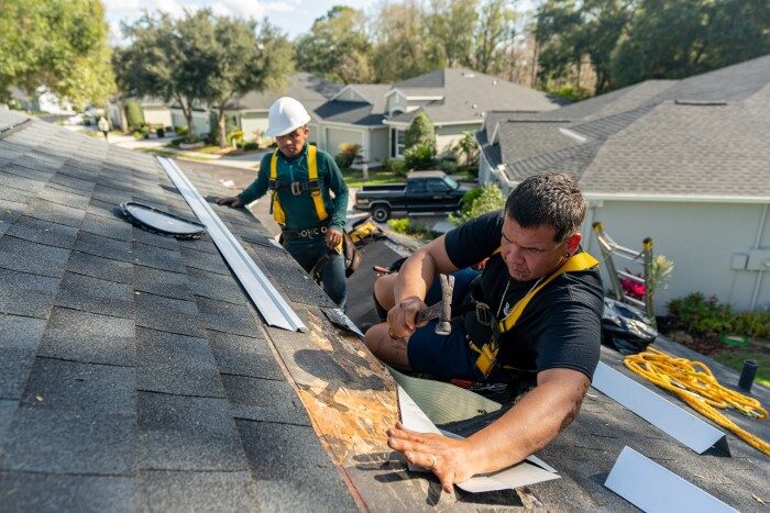 Emergency roof repair service fixing storm damage on a Daly City home roof.