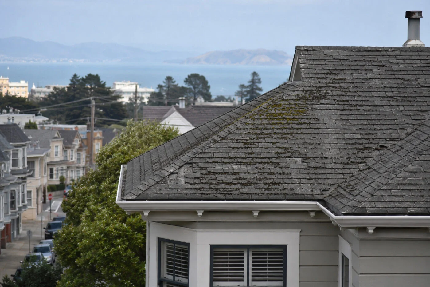 Aging asphalt shingle roof on a San Francisco home showing early signs of roof wear